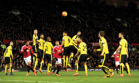 MANCHESTER: Manchester United's Juan Mata, second from right, scores his side's first goal of the game, during the English Premier League soccer match between Manchester United and Watford, at Old Trafford, in Manchester, England, Wednesday. – AP