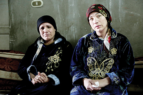 In this Thursday, March 3, 2016 photo, Fadya Shehata Moussa, left, and Iman Shaker Hanna, mothers of two of four Coptic Christian teens convicted for contempt of Islam, sit in the house of one of the teens in Bani Mazar, Minya province, Egypt. The teen boys were playing around, satirizing the extremist group, and their school supervisor just happened to be videoing them as they were imitating Muslim prayers and beheadings of the Islamic State group, their defenders say. The result has been catastrophic: The boys were sentenced to prison under Egypt’s blasphemy laws. (AP Photo/Thomas Hartwell)