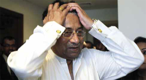 DUBAI: In this Sunday, March 24, 2013 file photo, former Pakistani President Pervez Musharraf reacts while arriving at his office for a press briefing before leaving to Karachi. — AP