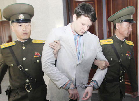 PYONGYANG: American student Otto Warmbier, center, is escorted at the Supreme Court.—AP