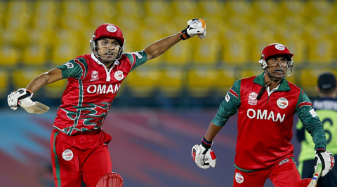 DHARMSALA: Oman's Ajay Lalcheta, left and Munis Ansari react after they won the ICC World Twenty20 2016 cricket tournament against Irelandnat the Himachal Pradesh Cricket Association (HPCA) stadium in Dharmsala, India, yesterday. Oman won by two wickets. – AP