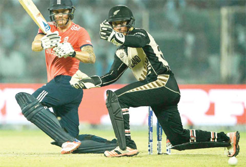 NEW DELHI: England’s Jason Roy (L) plays a shot past New Zealand’s wicketkeeper Luke Ronchi during the World T20 cricket tournament semi-final match between England and New Zealand at The Feroz Shah Kotla Cricket Ground. — AFP