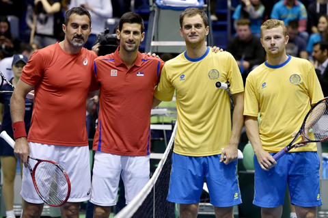(L-R) Serbia's tennis players Nenad Zimonjic and Novak Djokovic and Kazakhstan's tennis players Aleksandr Nedovyesov (L) and Andrey Golubev