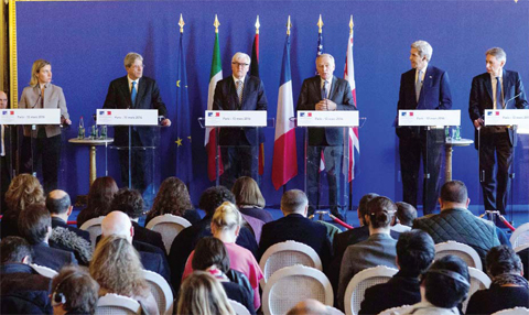 PARIS: (From left) The EU Foreign Policy chief Federica Mogherini, Italian Foreign Minister Paolo Gentiloni, German Foreign Minister Frank-Walter Steinmeier, French Foreign Minister Jean-Marc Ayrault, US Secretary of State John Kerry and British Foreign Secretary Philip Hammond speak following a meeting between the US and its European allies on the situations in Libya, Syria, Ukraine and Yemen. — AFP