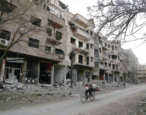 uildings in rebel-held part of Jubar neighborhood in the Syrian capital Damascus on Wednesday.—AFP