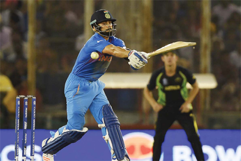 MPHALI: India’s Virat Kohli plays a shot during the World T20 cricket tournament match between India and Australia. —AFP