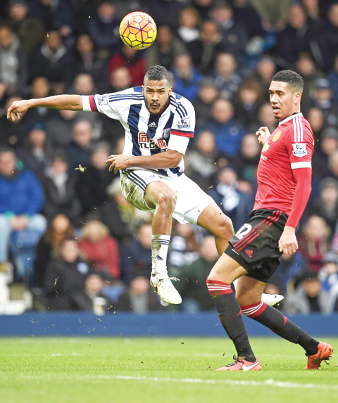WEST BROMWICH: West Bromwich Albion’s Venezuelan striker Salomon Rondon (L) has an unsuccessful shot during the English Premier League football match between West Bromwich Albion and Manchester United at The Hawthorns stadium in West Bromwich, central England, yesterday. — AFP