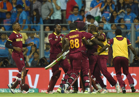 MUMBAI: West Indies players celebrate after winning the World T20 cricket tournament semi-final match against India at The Wankhede Cricket Stadium in Mumbai yesterday. - AFP 