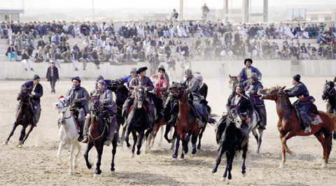 MAZAR-I-SHARIF: Afghan horsemen compete for a veal carcass during a game.
