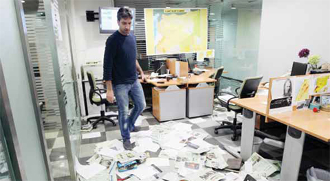 A journalist of the Saudi Asharq Al-Awsat daily looks at the damage yesterday after the newspaper’s offices were stormed following the publication of a cartoon mocking Lebanon