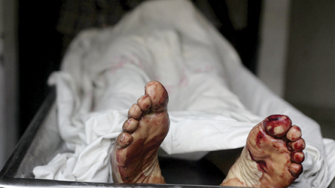 DHAKA: The body of Bangladeshi activist Xulhaz Mannan lies in a morgue at a hospital in Dhaka yesterday. — AFP