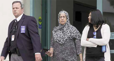 RIVERSIDE, California: An unidentified US Marshall court security officer escorts Rafia Farook, the mother of Syed Raheel Farook, out of federal court on Thursday. — AP