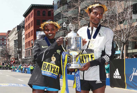 BOSTON: Women’s winner Atsede Baysa of Ethiopa and men’s winner Lemi Berhanu Hayle of Ethiopia pose at the finish line after winning the 120th Boston Marathon yesterday in Boston, Massachusetts. — AFP
