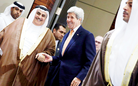 MANAMA: Bahrain’s Foreign Minister Sheikh Khalid bin Ahmed Al-Khalifa (left) and US Secretary of State John Kerry (center) arrive to speak to reporters ahead of the Gulf Cooperation Council (GCC) Ministerial meeting. — AFP