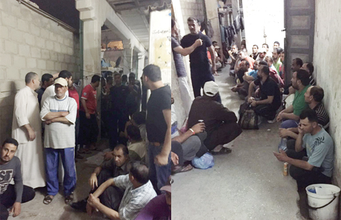 People rounded up during a police crackdown on fishermen’s residence in Sharq