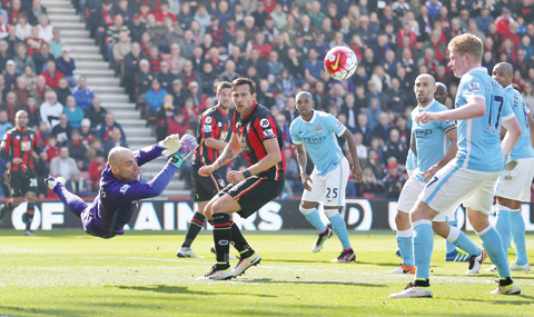 BOURNEMOUTH: Manchester City goalkeeper Willy Caballero makes a save during their English Premier League match against Bournemouth at the Vitality Stadium, Bournemouth, England, yesterday. - AP