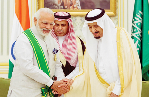 RIYADH: Saudi King Salman bin Abdulaziz welcomes India's Prime Minister Narendra Modi before a meeting in the capital yesterday. - AFP 