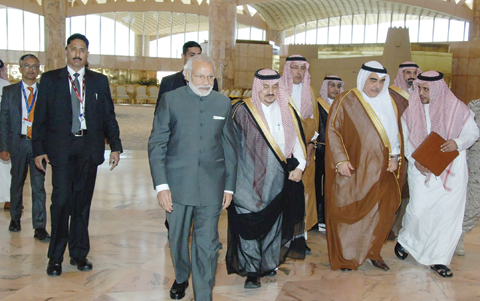 RIYADH: Governor of Riyadh province Prince Faisal bin Bandar bin Abdulaziz (center right) greets India's Prime Minister Narendra Modi (center left) upon his arrival yesterday. - AFP 