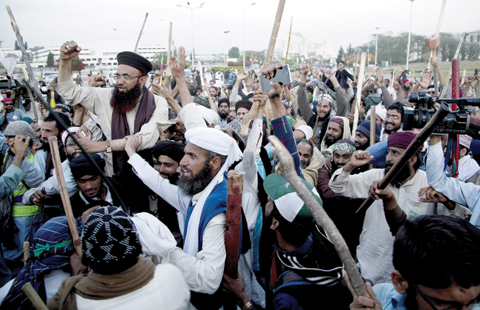 ISLAMABAD: In this Wednesday, March 30, 2016 file photo, protesters from the Pakistani religious group Sunni Tehreek celebrate the success of negotiations with government. — AP photos