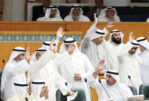 KUWAIT: MPs and ministers vote to drop the immunity of MP Abdulhameed Dashti during a parliament session at the National Assembly yesterday. — Photo by Yasser Al-Zayyat