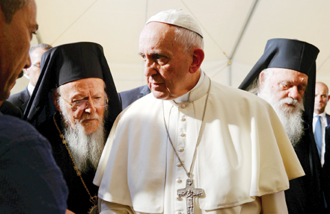 LESBOS, GREECE: Pope Francis, center, is flanked by Ecumenical Patriarch Bartholomew I, spiritual leader of the world’s Orthodox Christians, left, and Archbishop of Athens and All Greece Ieronymos II as they meet refugees at the Moria camp on Saturday. — AP