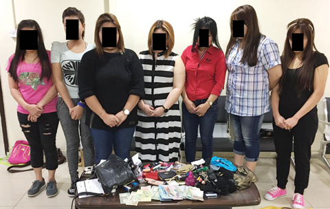 KUWAIT: This handout photo shows seven women arrested yesterday on prostitution charges.
