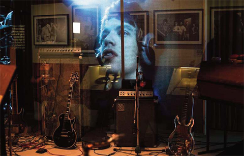 An image of Mick Jagger forms the backdrop of a recreated music studio as part of Exhibitionism