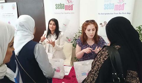 Sebamed staff demonstrate products to visitors