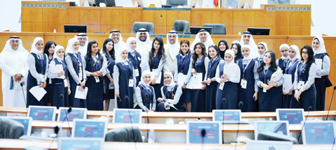 KUWAIT: National Assembly Speaker Marzouq Al-Ghanem, lawmakers and education ministry officials take a group photo with students at the end of the 3rd round of Student Parliament yesterday. — Photos by Yasser Al-Zayyat