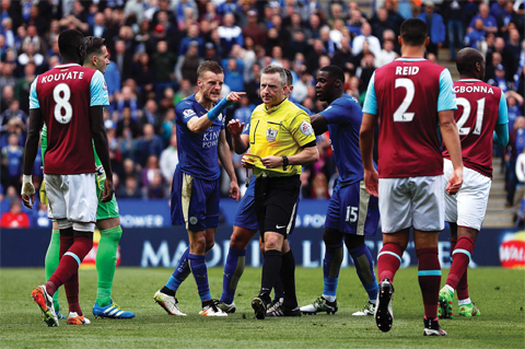 LEICESTER: Leicester City’s English striker Jamie Vardy (3L) reacts after referee Jonathan Moss (C) showed Vardy his second yellow card for simulation to send him off during the English Premier League football match between Leicester City and West Ham United at King Power Stadium in Leicester, central England on Sunday. — AFP