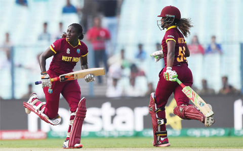 KOLKATA: West Indies’s Stafanie Taylor (L) and Hayley Matthews run between the wickets during the World T20 cricket tournament women’s final match between Australia and West Indies at The Eden Gardens Cricket Stadium in Kolkata yesterday. — AFP