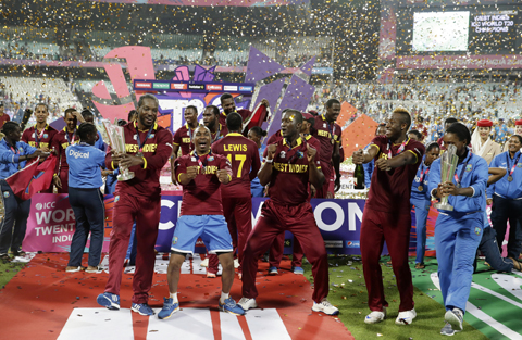 KOLKATA: The West Indies men's and women's team celebrate after winning their finals matches of the ICC World Twenty20 2016 cricket tournament at Eden Gardens in Kolkata, India, yesterday. – AP