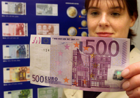 FLENSBURG, Germany: In this Sept 1, 2001 file photo, a woman holds a €500 banknote during a public presentation of the new currency at the branch office of the German Federal Bank. - AP