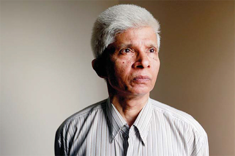 DHAKA: Dhaka University professor Azizur Rahman poses for a portrait at his home. — AP