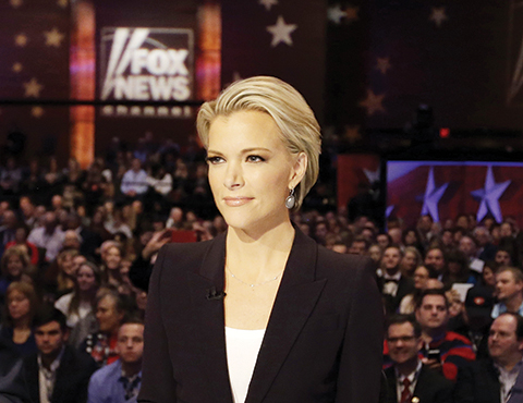 FILE - In this Jan. 28, 2016 photo, Moderator Megyn Kelly waits for the start of the Republican presidential primary debate in Des Moines, Iowa.  Donald Trump says people who are bullied ìgotta get over itî and fight back. Itís a message he delivers to Megyn Kelly, the Fox News anchor who sat down with him for an interview months after he savaged her on Twitter and elsewhere.  (AP Photo/Chris Carlson)