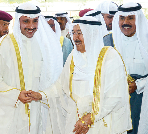 KUWAIT: HH the Amir Sheikh Sabah Al-Ahmad Al-Jaber Al-Sabah greets Speaker Marzouq Al-Ghanem as he attends the opening ceremony of the new Sabah Al- Ahmad building at the National Assembly yesterday, along with HH the Crown Prince Sheikh Nawaf Al-Ahmad Al-Jaber Al-Sabah. — KUNA
