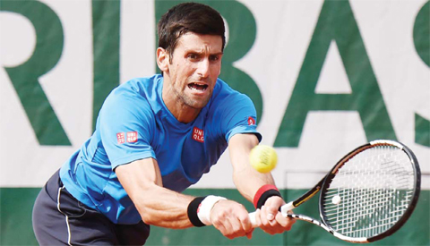 PARIS: Serbia's Novak Djokovic trains ahead of the 2016 Roland Garros French Tennis Open in Paris yesterday. - AFP 