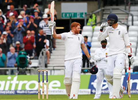 LEEDS: England’s Jonny Bairstow celebrates after reaching his hundred during play on the second morning of the first cricket Test match between England and Sri Lanka at Headingley. — AFP