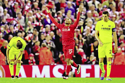 LIVERPOOL: Liverpool’s Daniel Sturridge, center, celebrates after scoring his side’s second goal during the Europa League semifinal, second leg, soccer match between Liverpool and Villarreal at Anfield Stadium. — AP