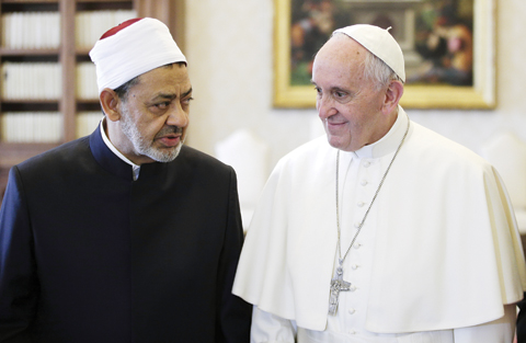 VATICAN CITY: Sheikh Ahmed Al-Tayeb, Grand Imam of Al-Azhar Mosque, talks with Pope Francis during a private audience in the Apostolic Palace yesterday. — AP