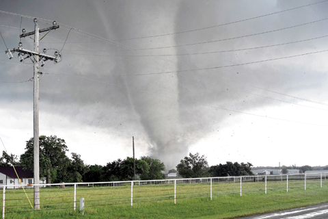 OKLAHOMA: A tornado rips through a residential area after touching down south of Wynnewood. — AFP