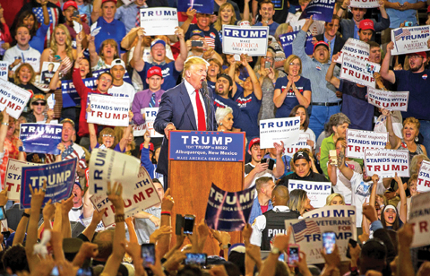 ALBUQUERQUE: Republican presidential candidate Donald Trump yells at a protester during a rally at the Albuquerque Convention Center on Tuesday. During the rally, the presumptive Republican presidential nominee was interrupted repeatedly by protesters, who shouted, held up banners and resisted removal by security officers. — AP