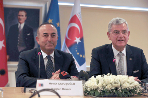 ANKARA : Turkish Foreign Minister Mevlut Cavusoglu (L) and Turkish EU Affairs Minister Volkan Bozkir (R) hold a press conference yesterday.-AFP
