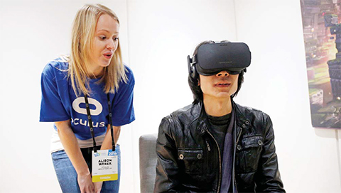 LAS VEGAS: Alison Weber (left) instructs Peijun Guo on using the Oculus Rift VR headset at the Oculus booth at CES International in Las Vegas. After delaying orders because of component shortages and angering wannabe early adopters, VR company Oculus is confronting another headache as it seeks to technologically and culturally establish the immersive medium. — AP