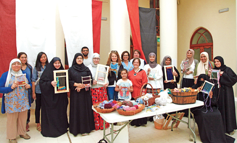 Group photo of the organizers and participants at the Woven Paintings: The Art of the Loom workshop recently held at Sadu House. — Photos by Athoob Al Shuaibi and Jamie Etheridge