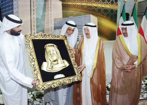 KUWAIT: His Highness the Amir Sheikh Sabah Al-Ahmad Al- Jaber Al-Sabah is presented with a gift to mark the occasion. — Amiri Diwan photos