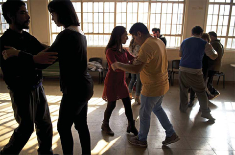 Patients, therapists and volunteers dance during the tango workshop at the Borda psychiatric hospital in Buenos Aires. — AFP photos