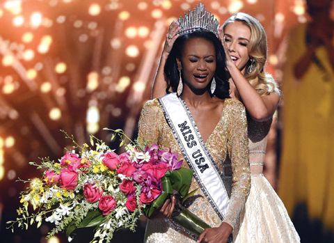 Miss District of Columbia USA 2016 Deshauna Barber (left) reacts as she is crowned Miss USA 2016 by Miss USA 2015 Olivia Jordan during the 2016 Miss USA pageant on June 5, 2016 in Las Vegas, Nevada. — AFP