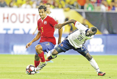 HOUSTON: Celso Borges #5 of Costa Rica battles for the ball with Marlos Moreno #21 of Colombia in the second half at NRG Stadium on Saturday in Houston, Texas. — AFP