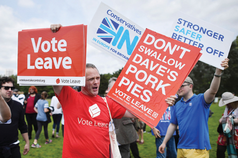 LONDON: A campaigner for ‘Vote Leave’, the official ‘Leave’ campaign organization, holds a placard during a rally for ‘Britain Stronger in Europe’, the official ‘Remain’ campaign group seeking to avoid Brexit, in Hyde Park yesterday. —AFP